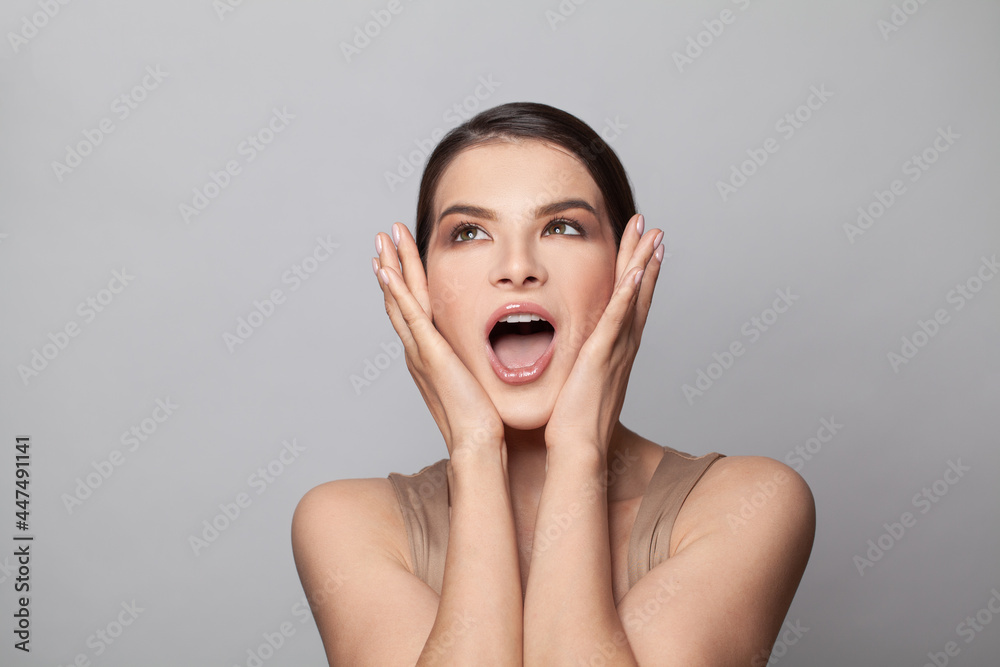 Shocked surprised woman with open mouth on white background Shocked surprised woman with open mouth on white background