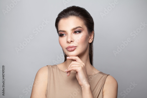 Cute woman thinking on white background
