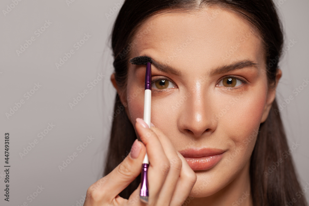 Professional eyebrow care and make-up. Woman face close up Professional eyebrow care and make-up. Woman face close up