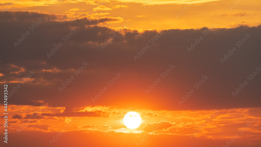 Beautiful sunset behind dark clouds