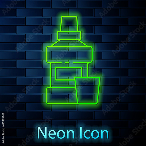 Glowing neon line Mouthwash plastic bottle and glass icon isolated on brick wall background. Liquid for rinsing mouth. Oralcare equipment. Vector