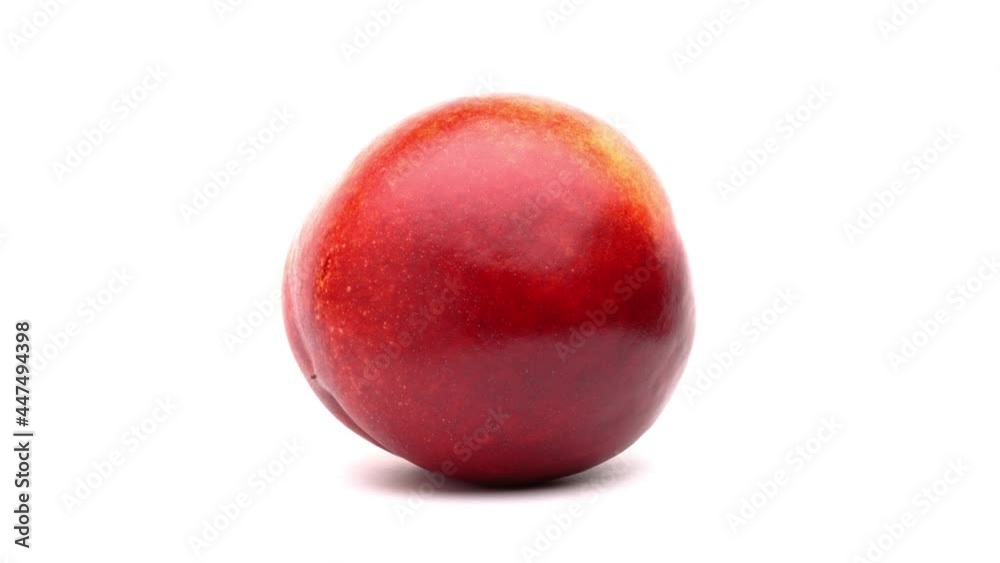 One nectarine rotating on white background.
One nectarine rotating on white background.