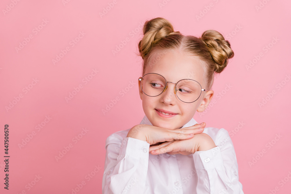 Photo of small girlish girl hands face look empty space wear white shirt spectacles isolated on pastel pink color background