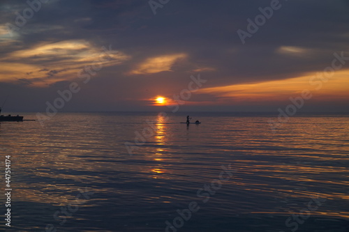 Dawn over the Black Sea and a man on a kayak who meets him.