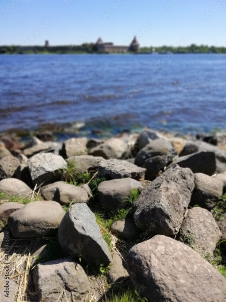 big cobblestones on the river bank on a sunny summer day big cobblestones on the river bank on a sunny summer day