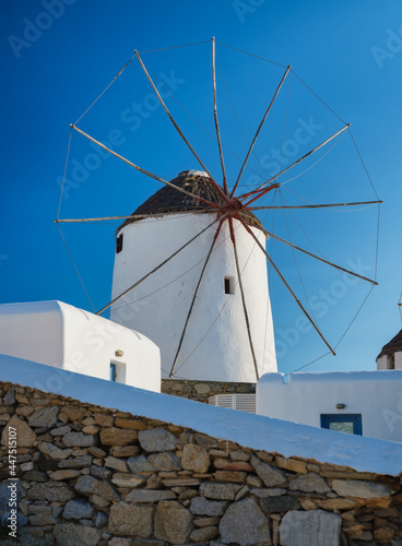Mykonos, Greece. Traditional windmills. The symbol of Mykonos at the day time. Landscape with traditional windmils. Photo for travel and vacation.