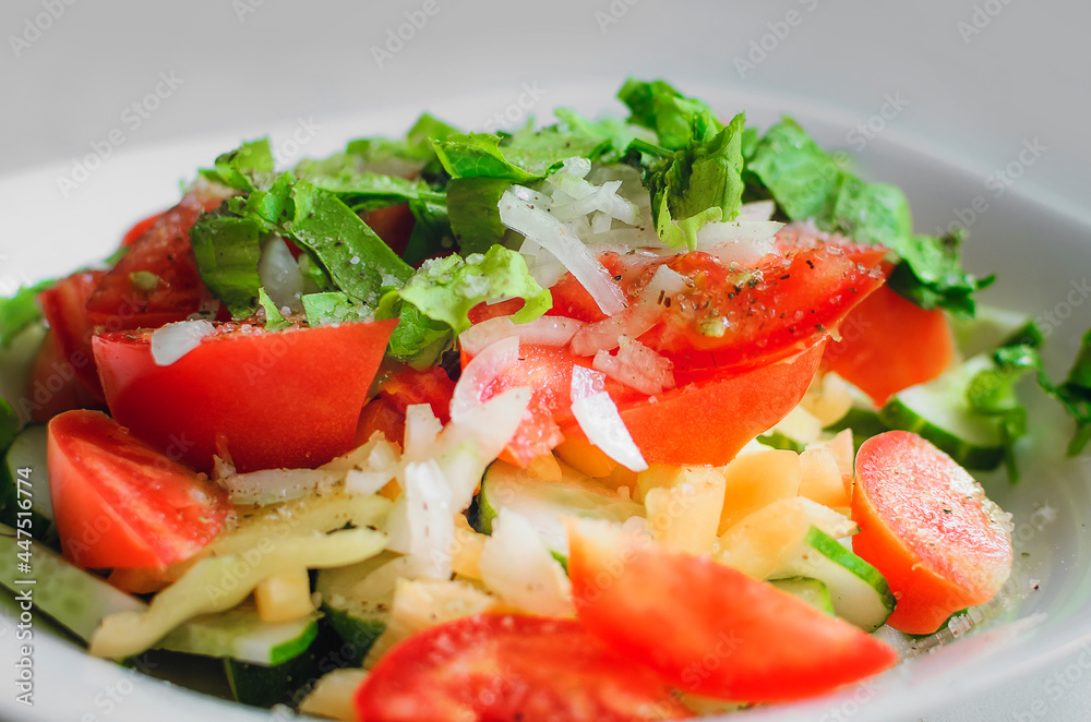 Chopped tomatoes, cucumbers, onions and green salad. Chopped tomatoes, cucumbers, onions and green salad.