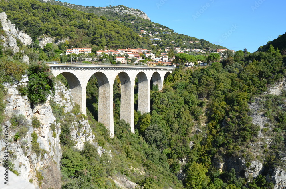 Road from Nice to Italy. View from the Moenne Kornice scenic road to the viaduct (stone Arch bridge) near the Eze village.