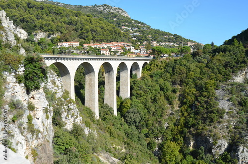 Road from Nice to Italy. View from the Moenne Kornice scenic road to the viaduct (stone Arch bridge) near the Eze village.