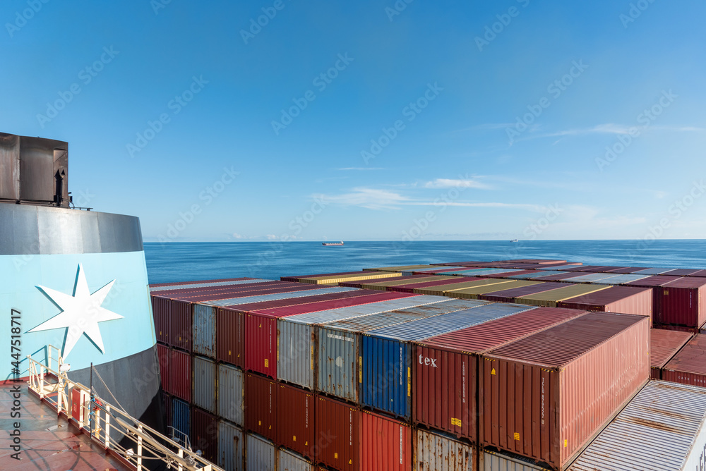 Containers loaded on the cargo ship owned by Maersk Line. Ship sailing