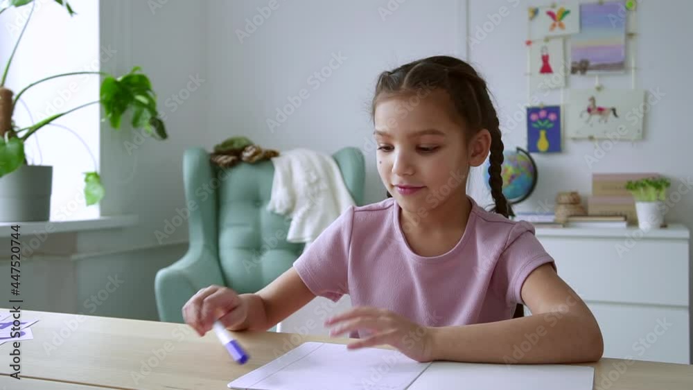 Online school education girl opens notebook and takes pen Spbd Online school education girl opens notebook and takes pen Spbd