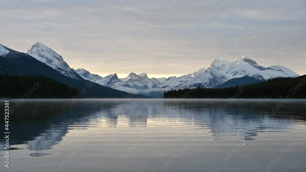 Canadian Rockies with foggy on Maligne lake in the morning at Jasper national park Canadian Rockies with foggy on Maligne lake in the morning at Jasper national park