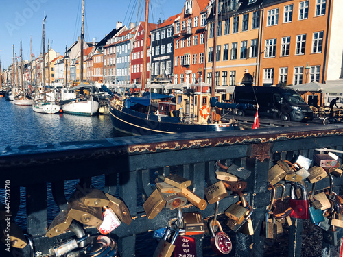 Copenhagen, Denmark Nyhavn Waterfront Canal Entertainment Brightly Coloured Tourist Destination Padlocks on bridge