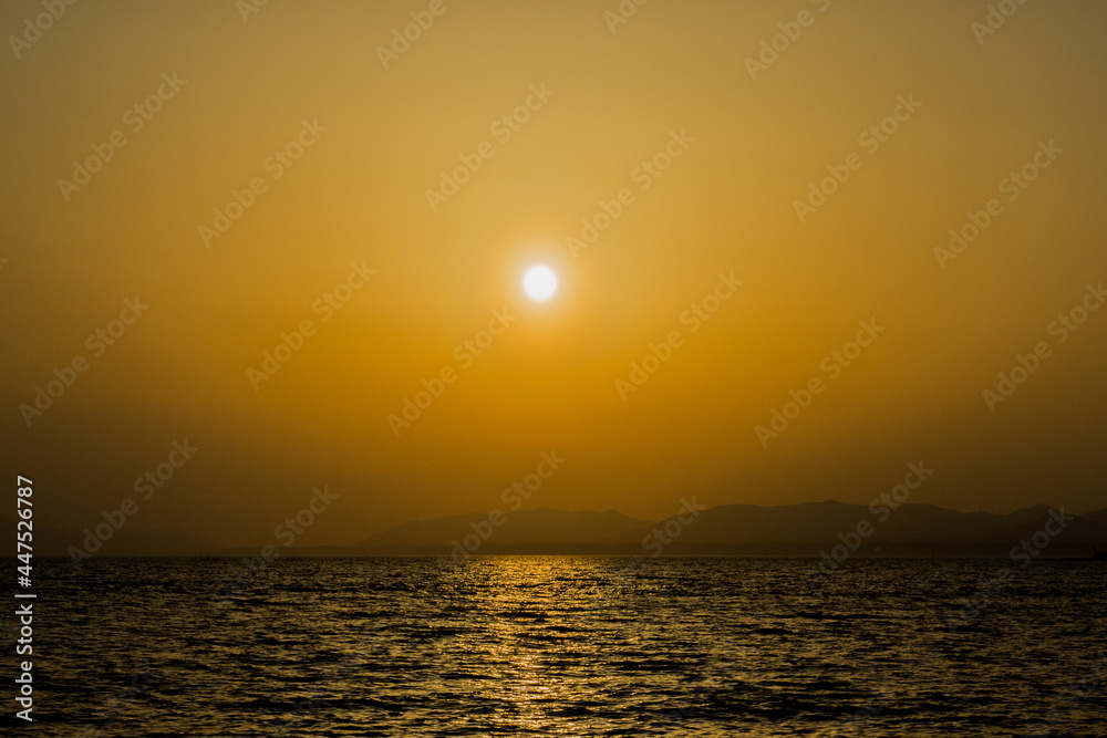 sunset over the lake shinji