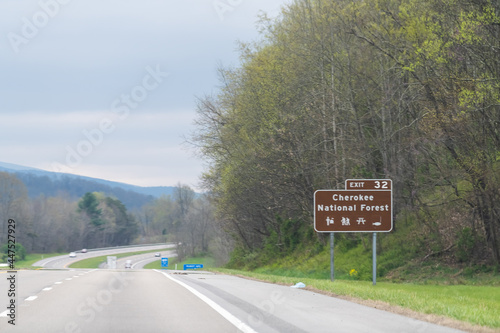 Smoky Mountains in North Carolina or Tennessee with cloudy sky on South 25 highway road and sign for Cherokee national forest photo
