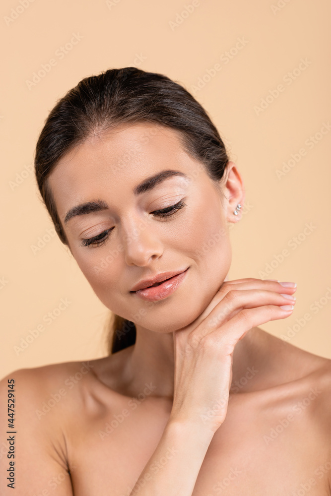 positive woman with clean skin holding hand near chin isolated on beige, beauty concept positive woman with clean skin holding hand near chin isolated on beige, beauty concept