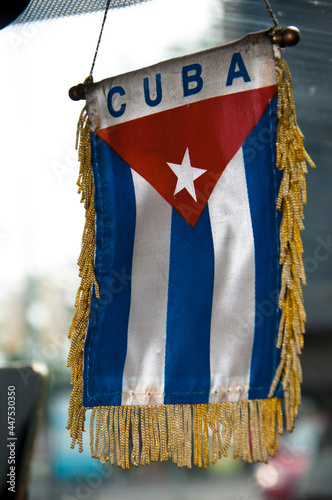 cuban flag hanging in car. for a free cuba. cuba libre. island of freedom. cuban revolution photo