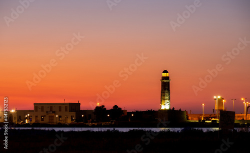 Lighthouse in the orange sunset Rethymno, Crete, Greece