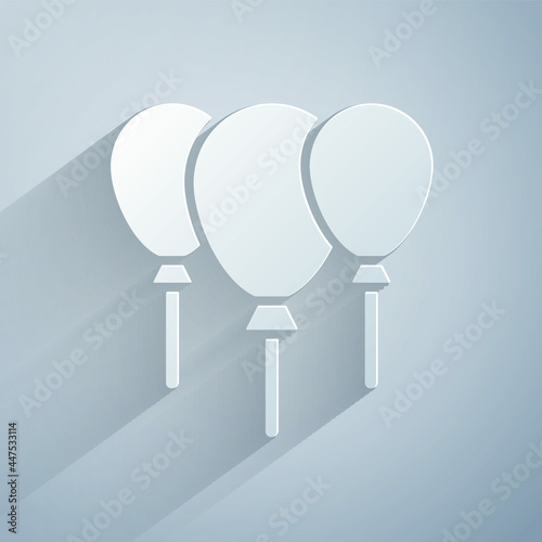 Paper cut Balloons with ribbon icon isolated on grey background. Merry Christmas and Happy New Year. Paper art style. Vector