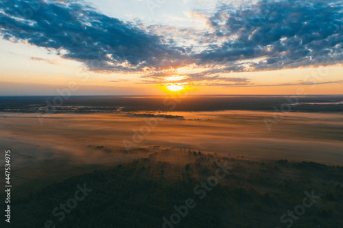 Field covered by fog at Sunrise, top view © Viachaslau