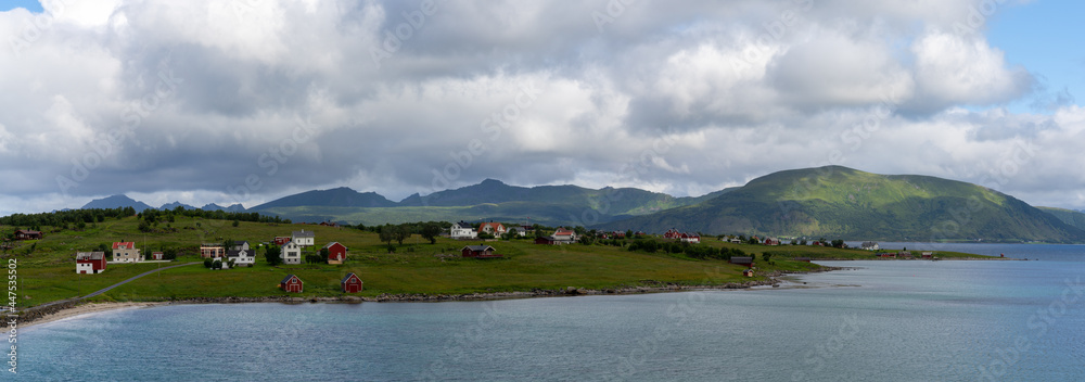 picturesque panorama landscape of the Lofoten Islands with sandy beach and turquoise water and quaint coastal village picturesque panorama landscape of the Lofoten Islands with sandy beach and turquoise water and quaint coastal village