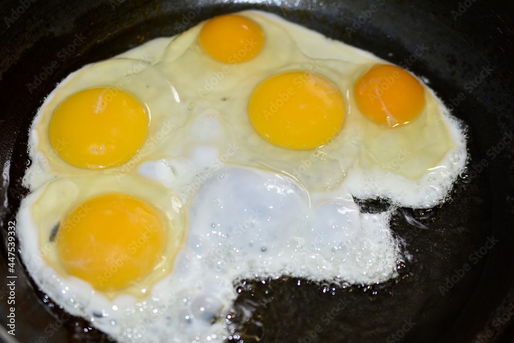 Frying fried eggs in a frying pan Frying fried eggs in a frying pan