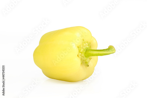 Single yellow bell pepper isolated on white background. Shiny paprika