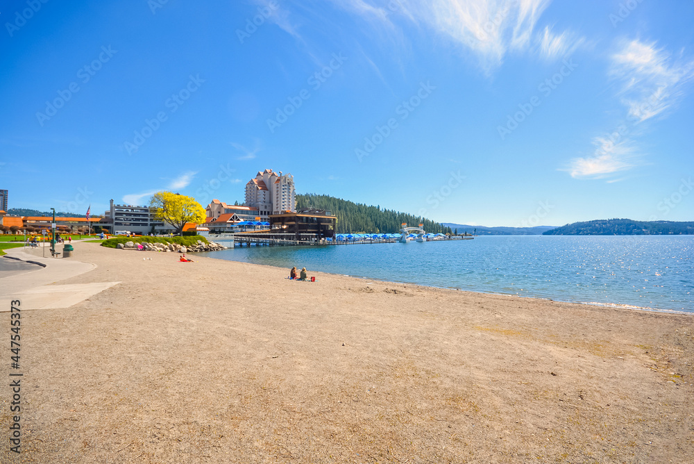 Autumn morning on the shores of Lake Coeur d'Alene with a resort, marina, sandy beach and Tubbs Hill in the background in Coeur d'Alene, Idaho USA