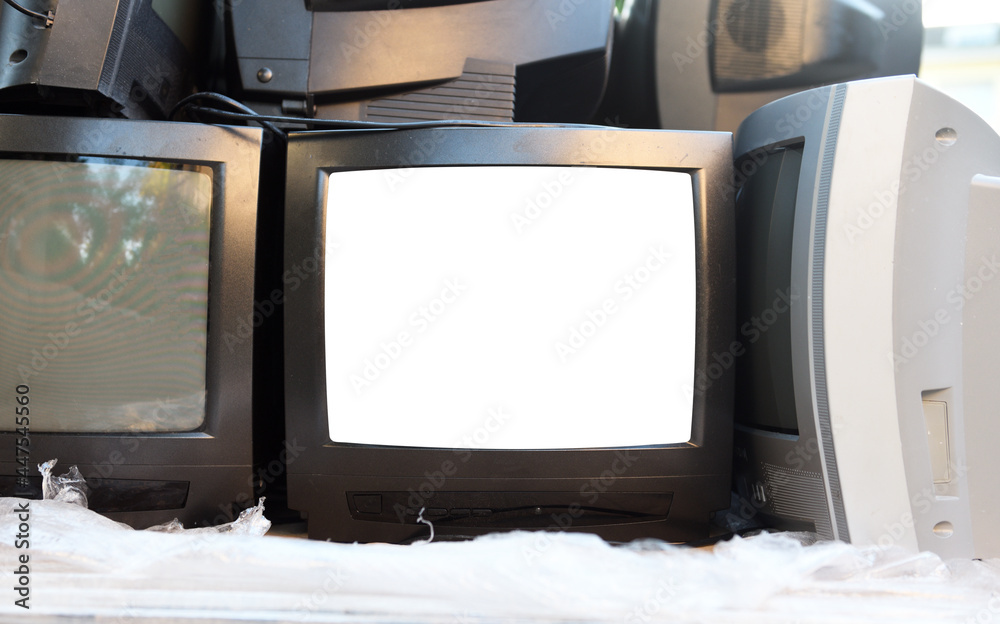 Dump trash can of old CRT TVs with white screens for adding images
