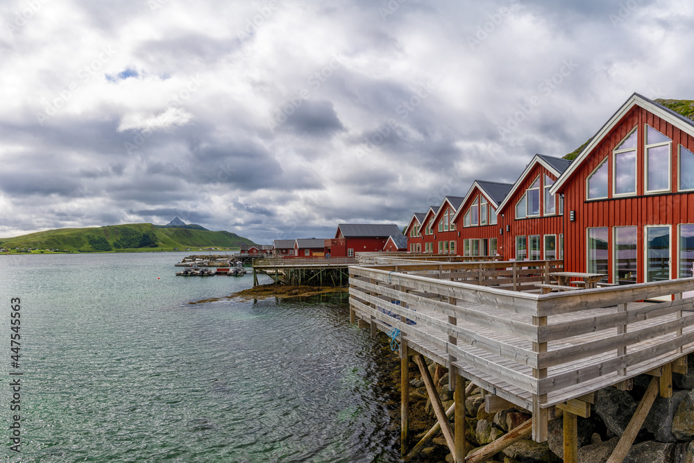 colorful red wooden houses on the oceanfront in the Lofoten Islands of Norway