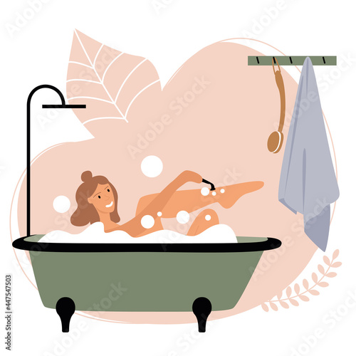 Smiling white girl with fair hair takes a bath with soap bubbles in the bathroom. Green bubble bath. Home cute interior. Hygiene and body care.