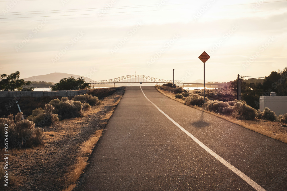 Bike path along Columbia river with bridge in distance