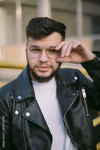 Hipster man in the city portrait wearing glasses