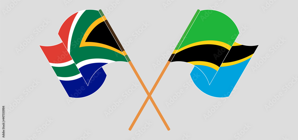 Crossed and waving flags of Republic of South Africa and Tanzania