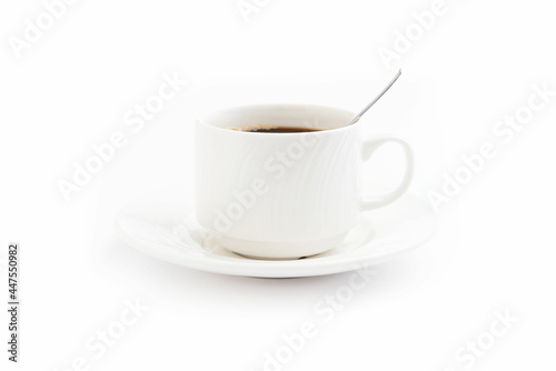 White coffee mug with spoon isolated on white background