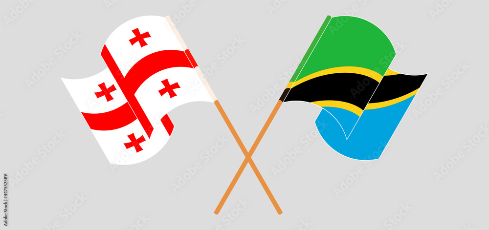 Crossed and waving flags of Georgia and Tanzania Crossed and waving flags of Georgia and Tanzania