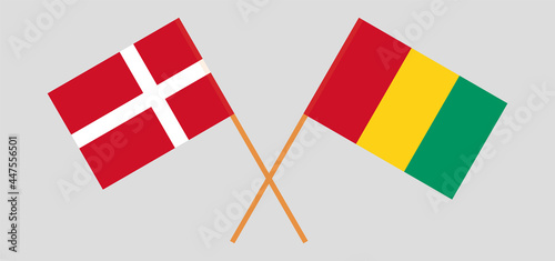 Crossed flags of Denmark and Guinea. Official colors. Correct proportion