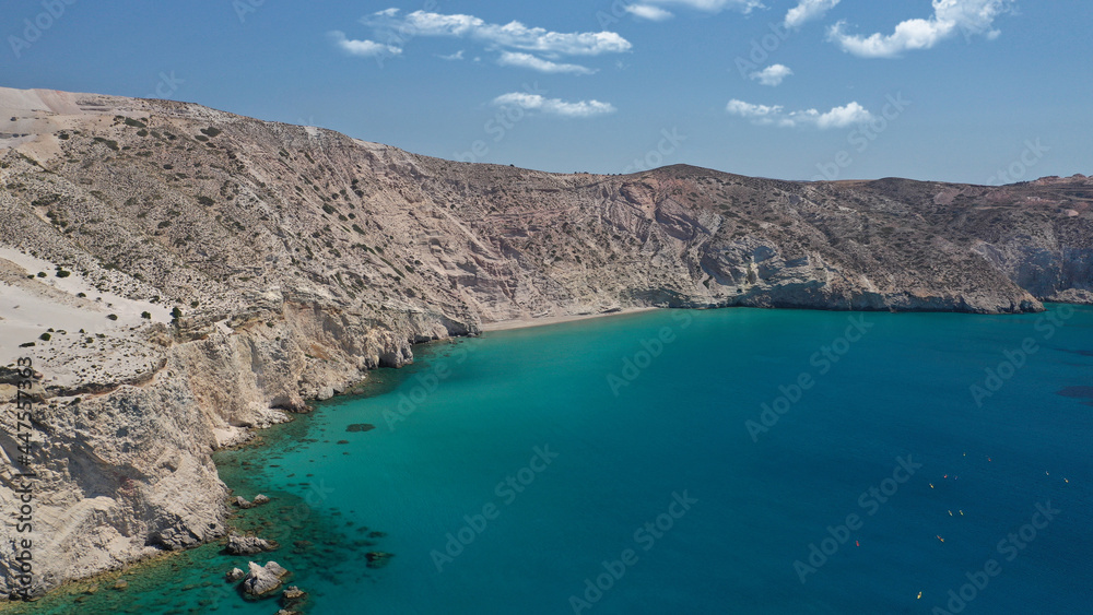 Aerial drone photo of secluded paradise sandy beach of Kalamos mostly covered by perlite rock only accessible by boat, Milos island, Cyclades, Greece Aerial drone photo of secluded paradise sandy beach of Kalamos mostly covered by perlite rock only accessible by boat, Milos island, Cyclades, Greece