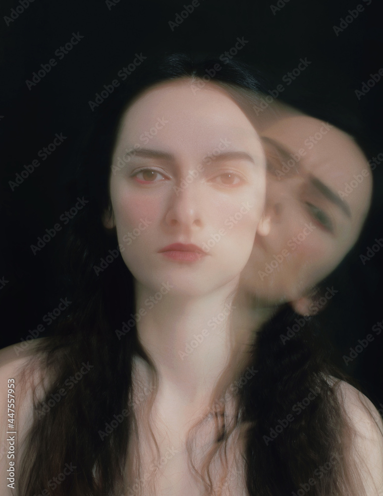 Dramatic psychological portrait of a woman on black, long exposure Dramatic psychological portrait of a woman on black, long exposure