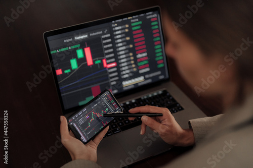 Business woman analyzing stock market charts