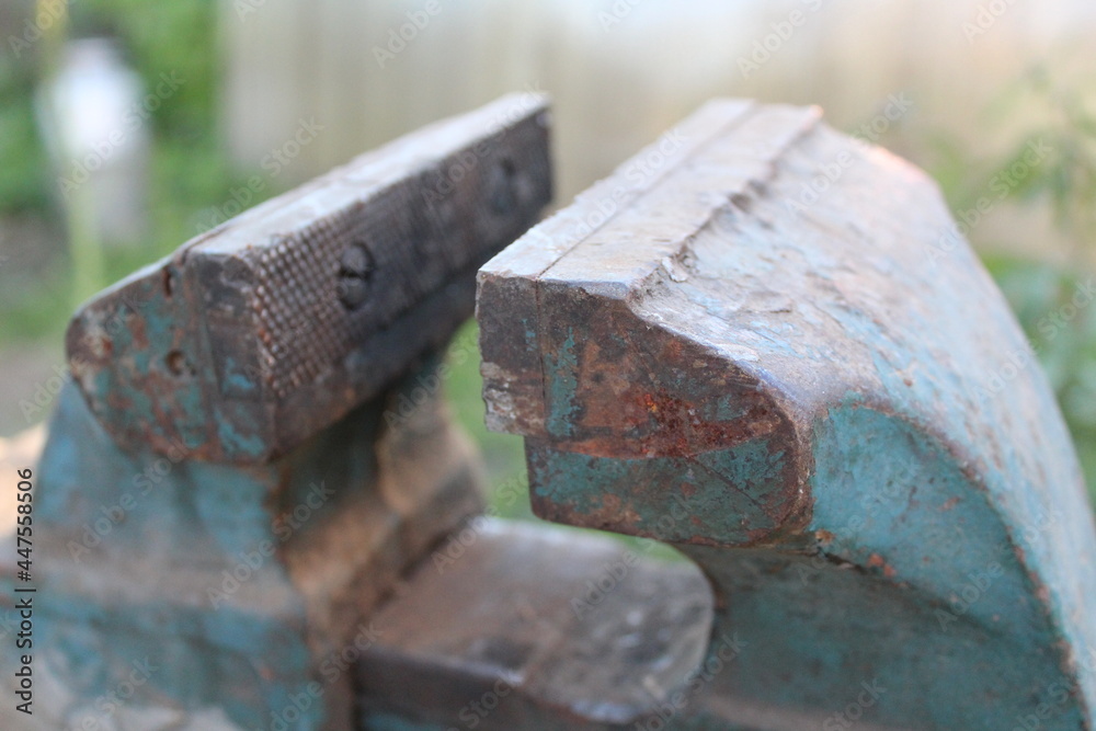 old locksmith vise in the yard of the house old locksmith vise in the yard of the house