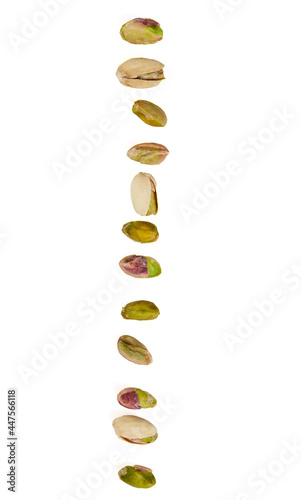 row of pistachio isolated on white background