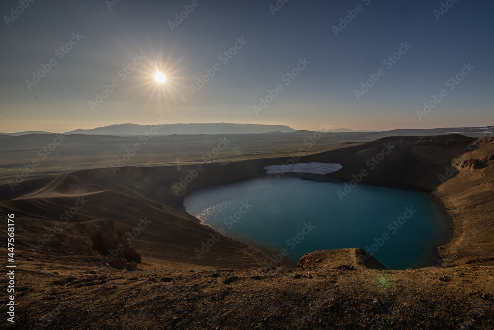 Viti crater in Krafla area of Iceland viewed from one of the outlook posts, on a nice summer evening, with sun slowly setting down.