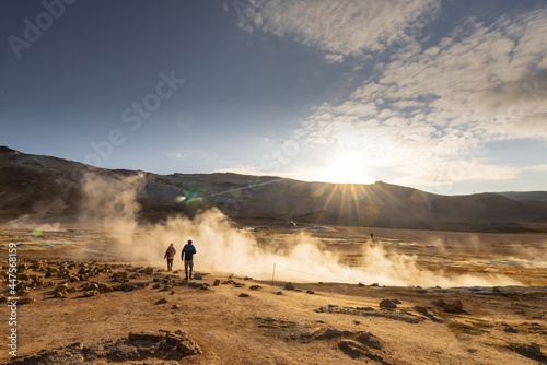 Hverir geothermal mud springs in Iceland close to lake Myvatn. View of sulphur fumes and bubbling lakes of mud with some visitors. © Anze