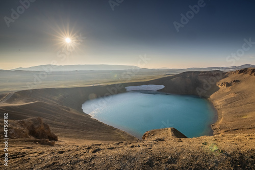 Viti crater in Krafla area of Iceland viewed from one of the outlook posts, on a nice summer evening, with sun slowly setting down.