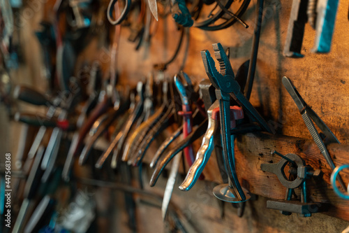 A lot of old rusty instruments in vintage dirty garage.