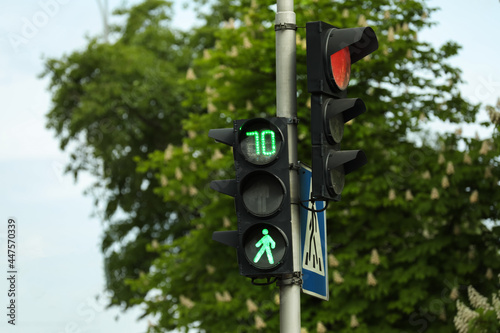 View of modern traffic lights on city street