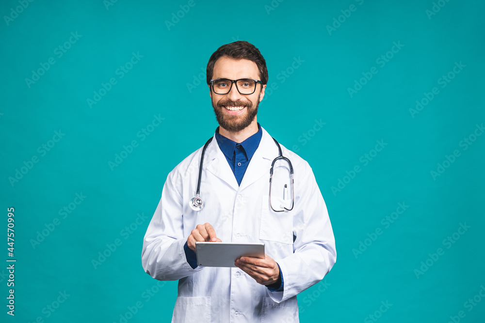 Portrait of young bearded doctor man with stethoscope over neck in medical coat standing against isolated blue background. Portrait of young bearded doctor man with stethoscope over neck in medical coat standing against isolated blue background.