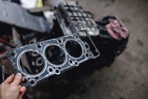 replacing the cylinder head gasket in the garage photo