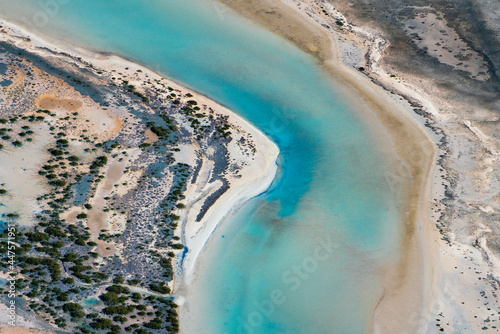 Canvastavla Abstract aerial view of blue-green water in shifting red deposition of sediment gradually moving through alluvial plains of Francois Peron National Park in Western Australia